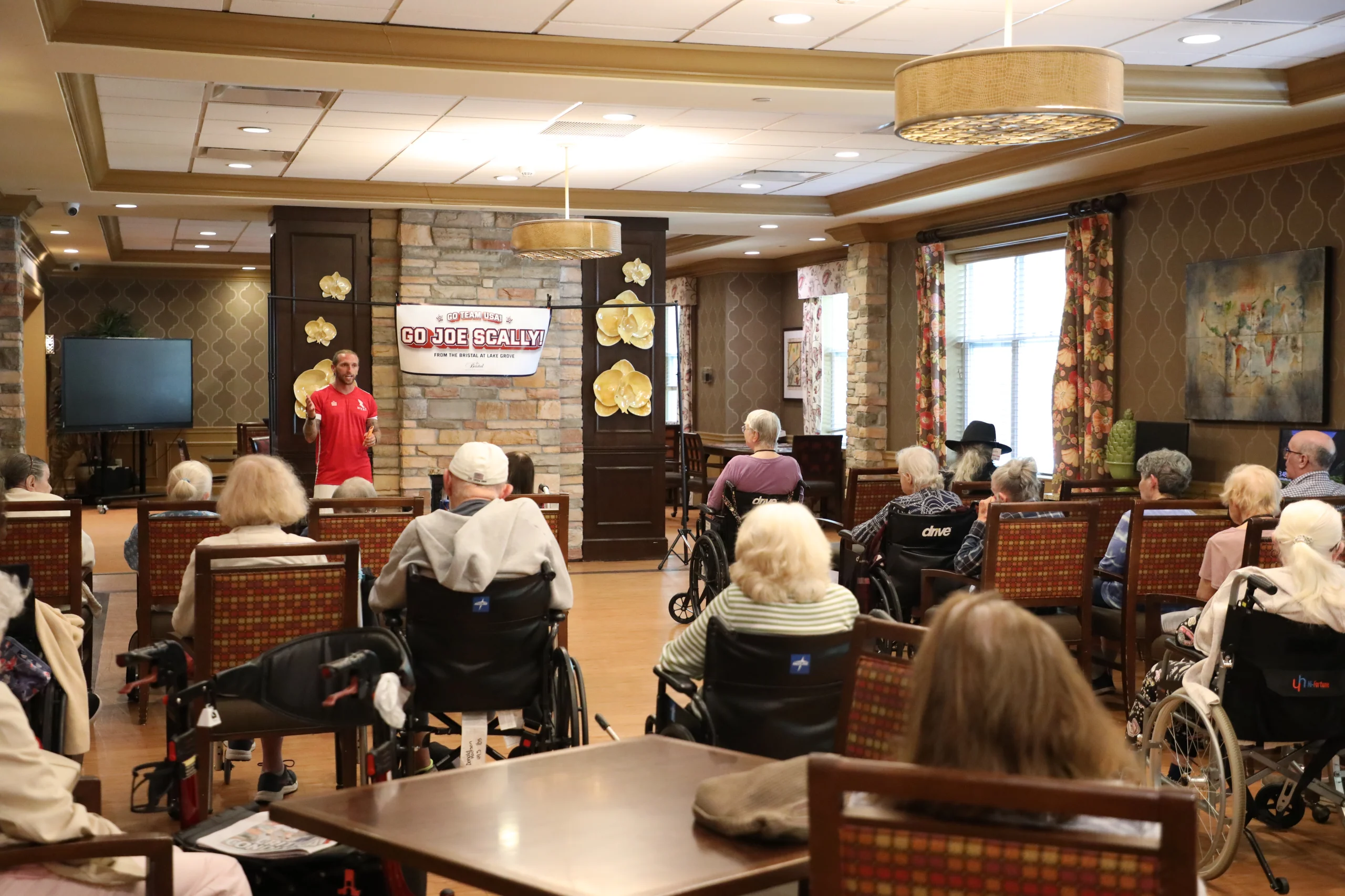 Residents attending an educational presentation on the history of the World Cup at The Bristal at Lake Grove