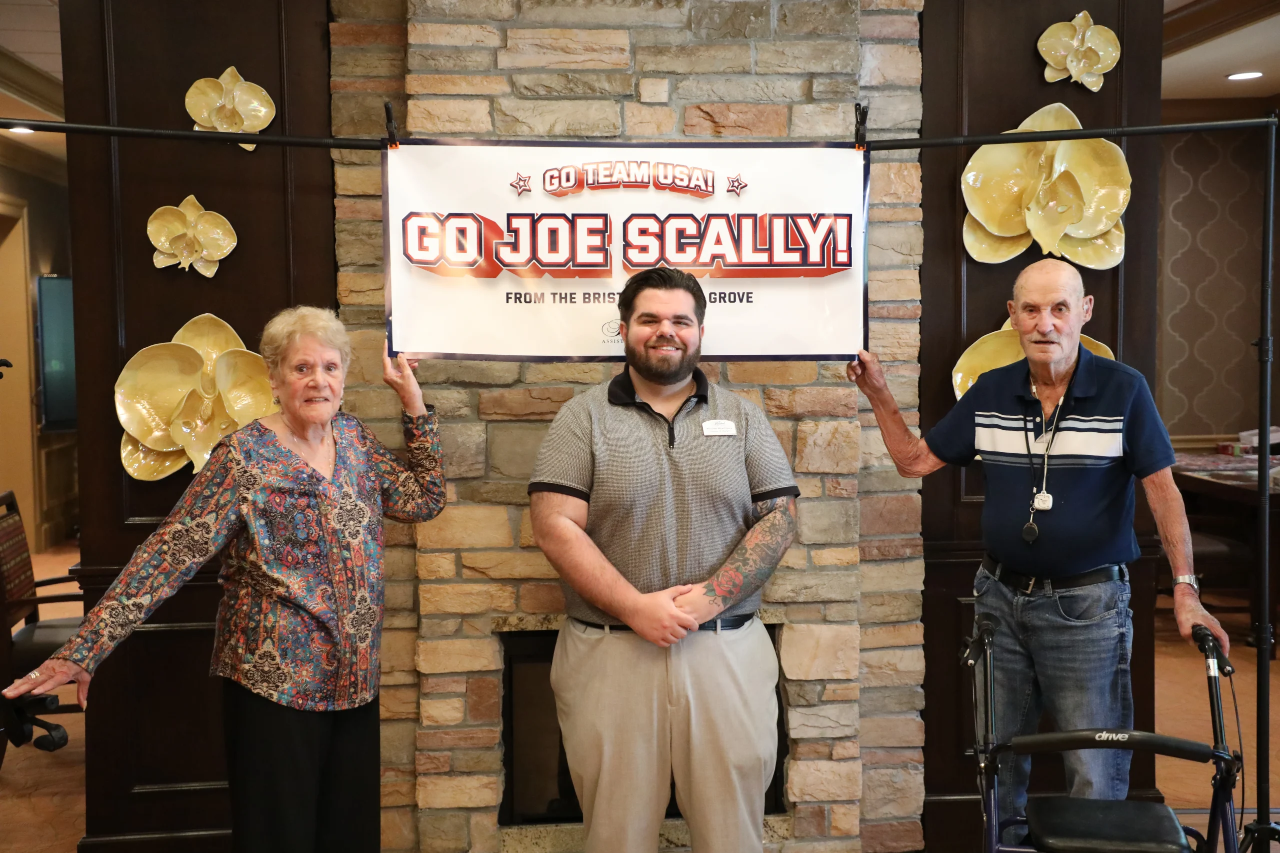 Residents and team members at The Bristal at Lake Grove celebrate Joe Scally's appearance on Team USA for the FIFA World Cup