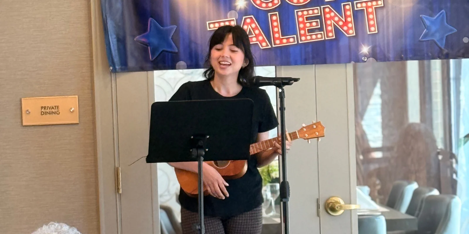 The Bristal at York Avenue Celebrates Team Week -team member plays ukulele in the talent show