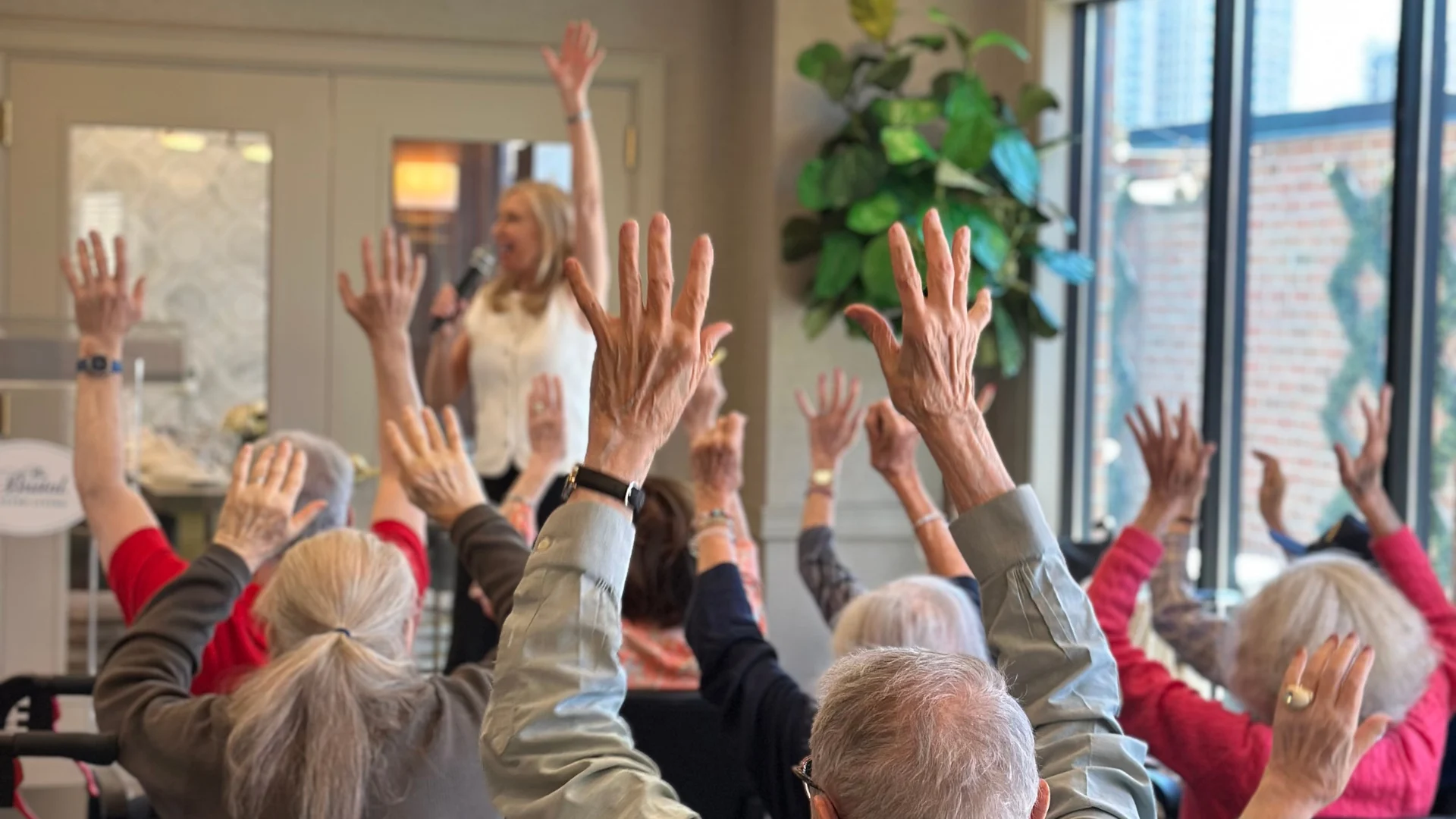 Residents of The Bristal at York Avenue participate in Roberta's fitness class and book talk