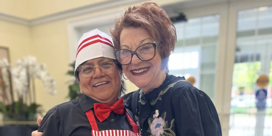 Grandparents Day at The Bristal at North Woodmere - team member poses with resident
